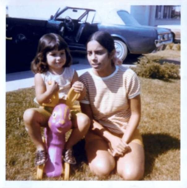 Color photograph of Ana Mendieta and a child