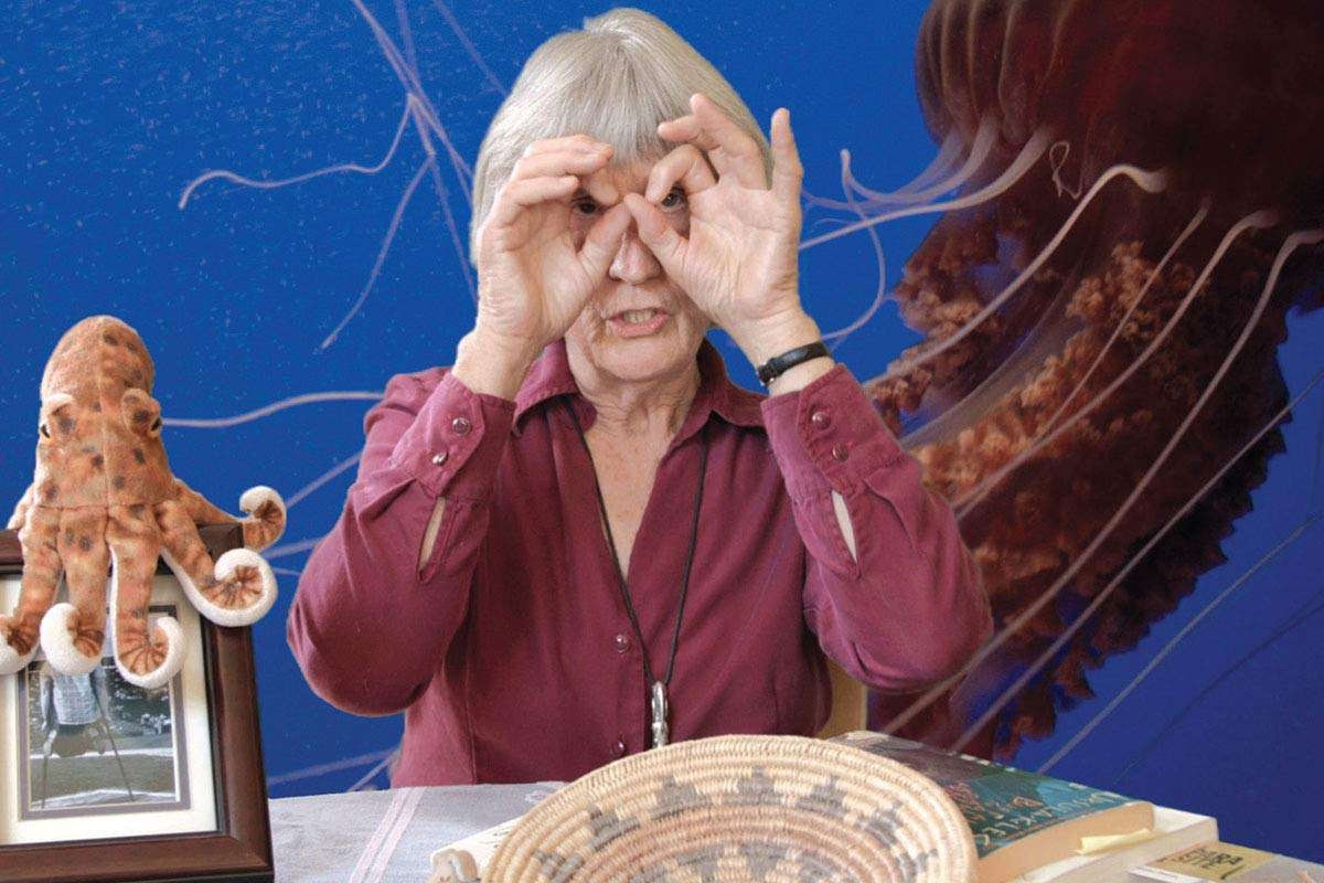 Color photograph of Donna Haraway with a jellyfish and an octopus (both hermaphrodites)